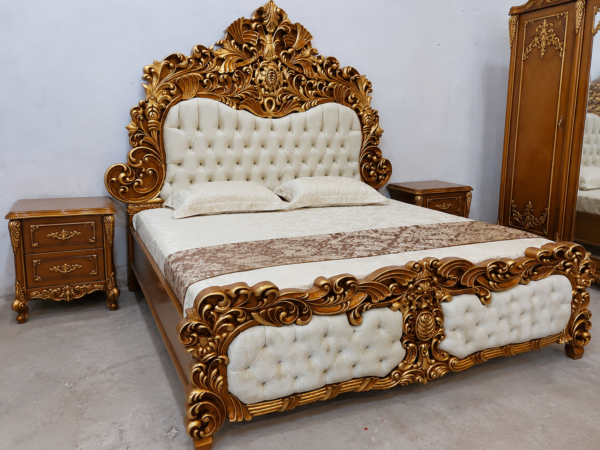 Wooden carving double bed Luxury royal carved bed set with antique gold finish, tufted upholstered headboard, matching side tables, and designer wardrobe for premium bedroom interiors.