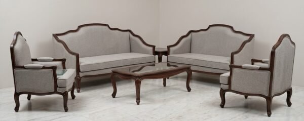 Luxury premium wooden sofa set with premium beige fabric upholstery, handcrafted detailing, elegant center table, and royal living room furniture design.