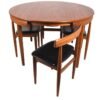 Wooden dinning table “Modern round solid wood dining table set with four chairs, featuring a foldable design and premium finish for compact and stylish dining spaces”